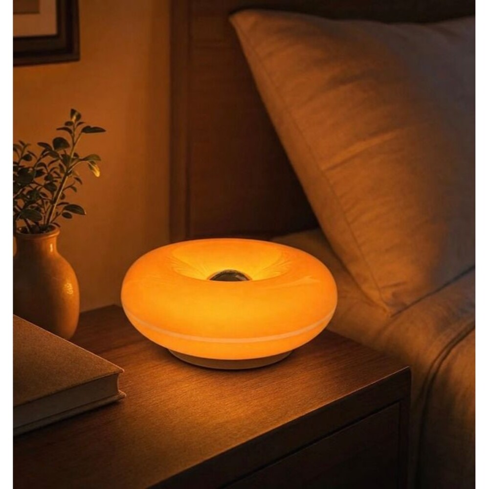 Doughnut shaped bedside lamp with warm light